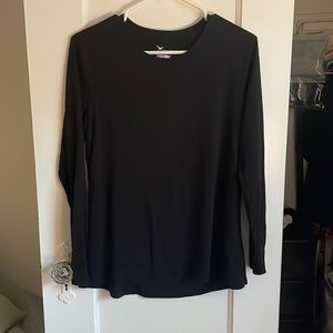 Excellent condition. Black long sleeve with cut out in back.